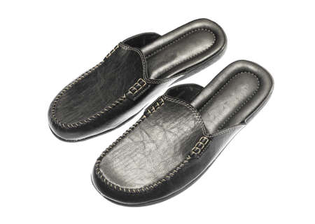 men's leather black slippers on a white backgroundの写真素材