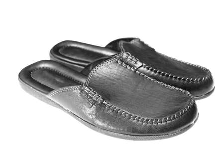 men's leather black slippers on a white backgroundの写真素材