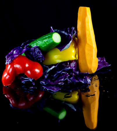 group of vegetables for salad on a black backgroundの写真素材