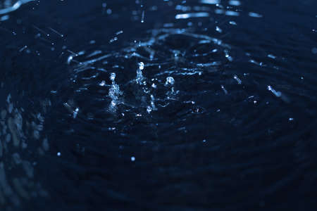 crown formed by a water spray on a black background