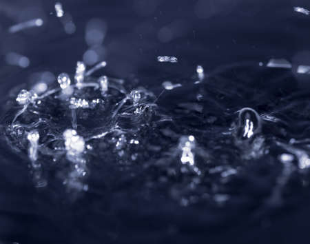 crown formed by a water spray on a black background