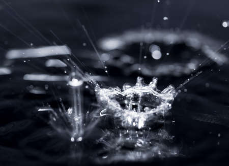 crown formed by a water spray on a black background