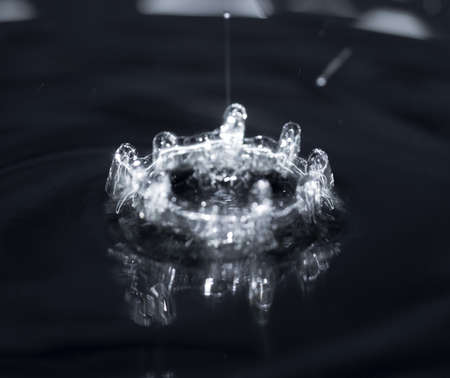 crown formed by a water spray on a black backgroundの写真素材