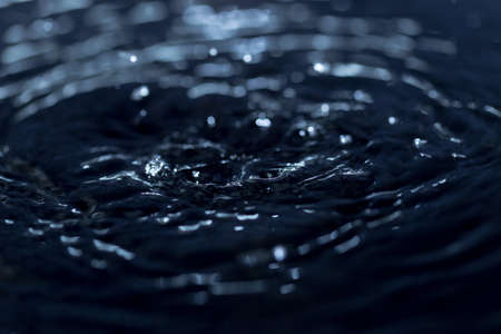 crown formed by a water spray on a black backgroundの写真素材