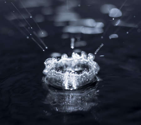 crown formed by a water spray on a black background