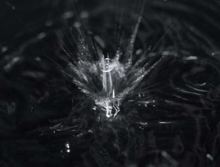 crown formed by a water spray on a black background