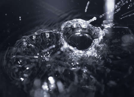 crown formed by a water spray on a black background