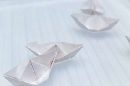 paper boat on waterの写真素材