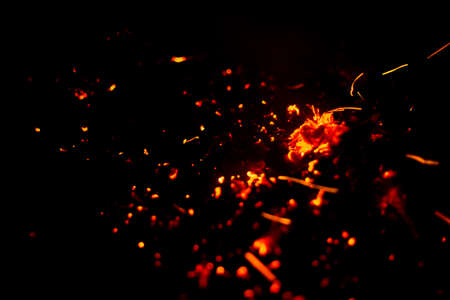 Flame of fire with sparks on a black background