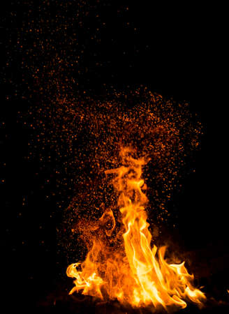 Flame of fire with sparks on a black background