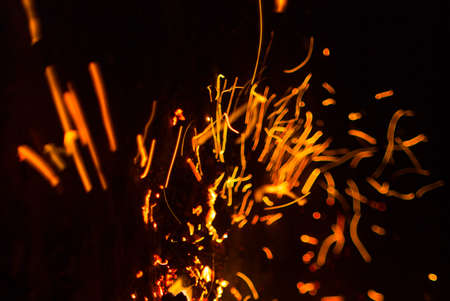 Flame of fire with sparks on a black background