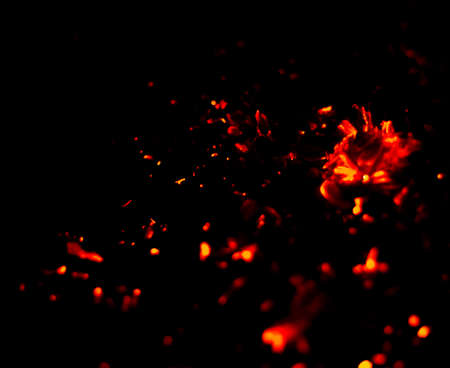 Flame of fire with sparks on a black background
