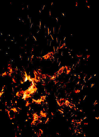 Flame of fire with sparks on a black background