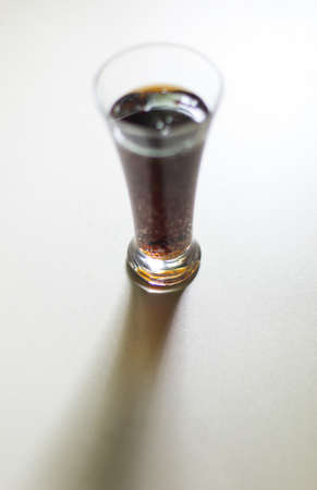 dark drink in a glassの写真素材