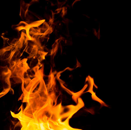 Flame of fire with sparks on a black background