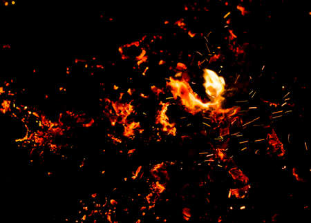 Flame of fire with sparks on a black background