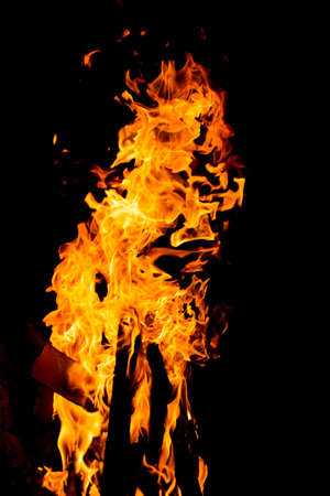 Flame of fire with sparks on a black backgroundの写真素材