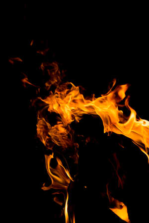 Flame of fire with sparks on a black background