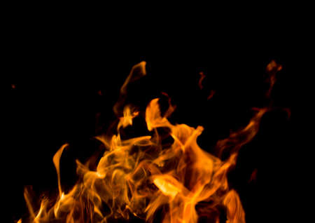 Flame of fire with sparks on a black background