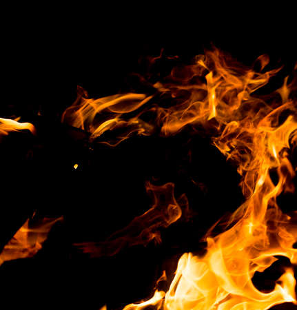 Flame of fire with sparks on a black background