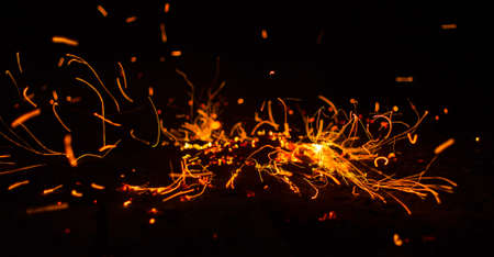 Flame of fire with sparks on a black background
