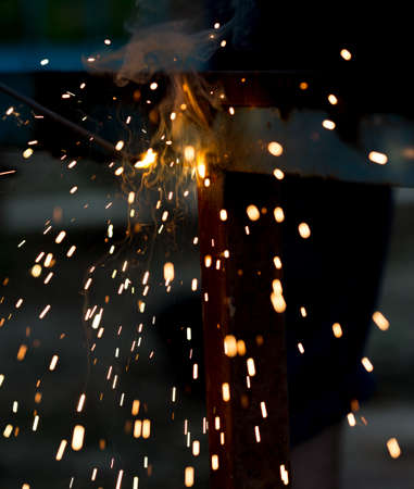 Flash and sparks from electric welding