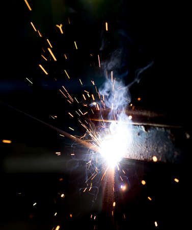 Flash and sparks from electric welding