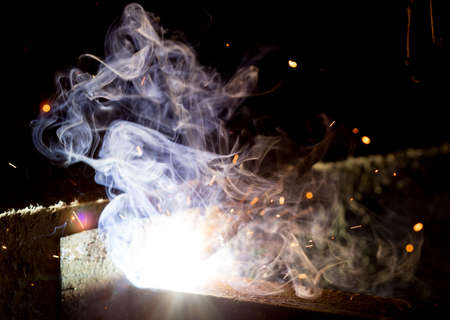 Flash and sparks from electric welding