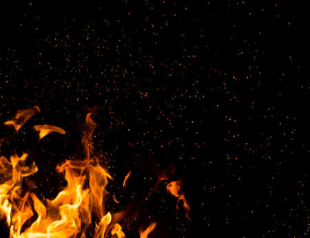 Flame of fire with sparks on a black background