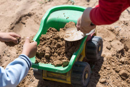 children playing in the sand