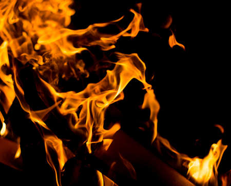 Flame of fire with sparks on a black backgroundの写真素材