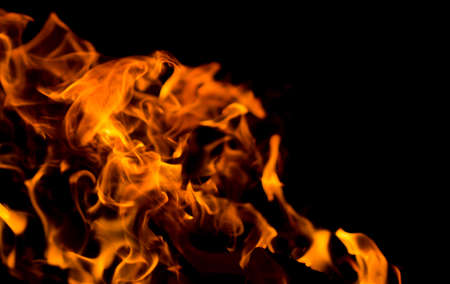 Flame of fire with sparks on a black background