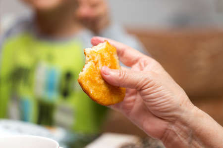 man eats delicious pancakes for breakfastの写真素材