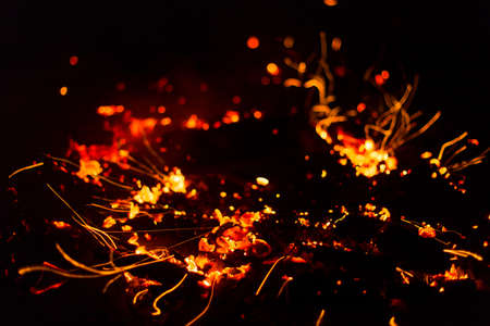 Flame of fire with sparks on a black background
