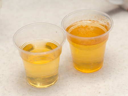 Dirty water, through filtration after cleaning on a plastic cupの写真素材