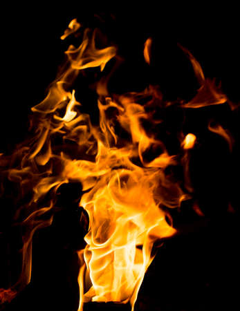 Flame of fire with sparks on a black background