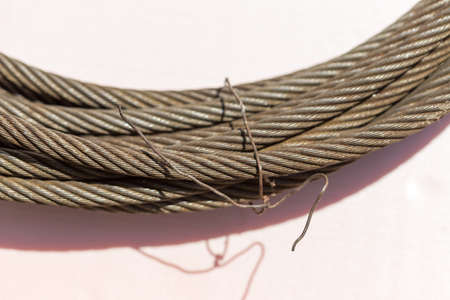 Detail of a steel cable on whiteの写真素材