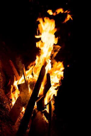 Flame of fire with sparks on a black background