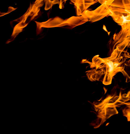 Flame of fire with sparks on a black background