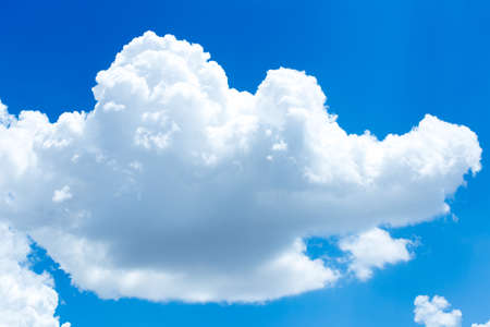 Blue sky background with cloudsの写真素材