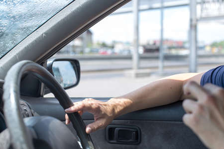 driver driving a carの写真素材