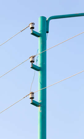 Electrical pole and wires against the skyの写真素材