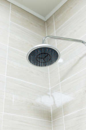 A round shaped shower head in the bathroomの写真素材