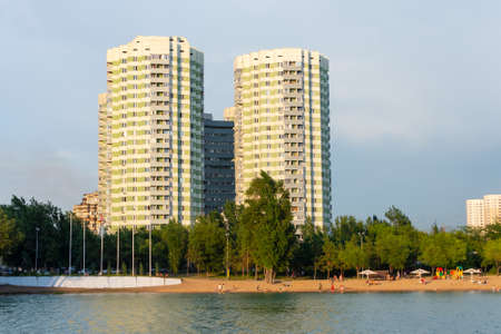 View of the skyscrapers and the mountain at Lake Sairan in the city of Almatyの写真素材