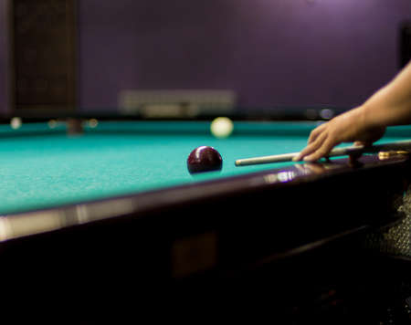 Playing billiard - Close-up shot of a man playing billiard