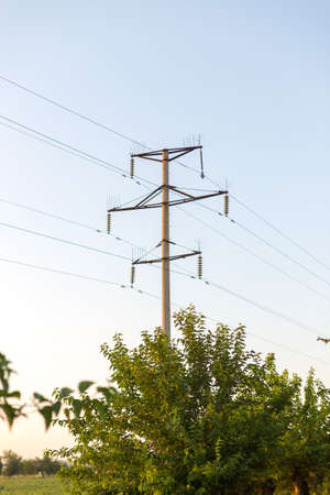 Electrical pole and wires against the sky