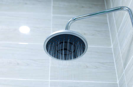 A round shaped shower head in the bathroomの写真素材