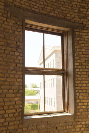 Old brick windows from inside the building and sunlight