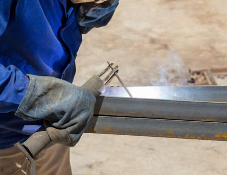 Welder at the factory working with metal constructionの写真素材