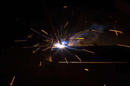 Flash and sparks from electric welding